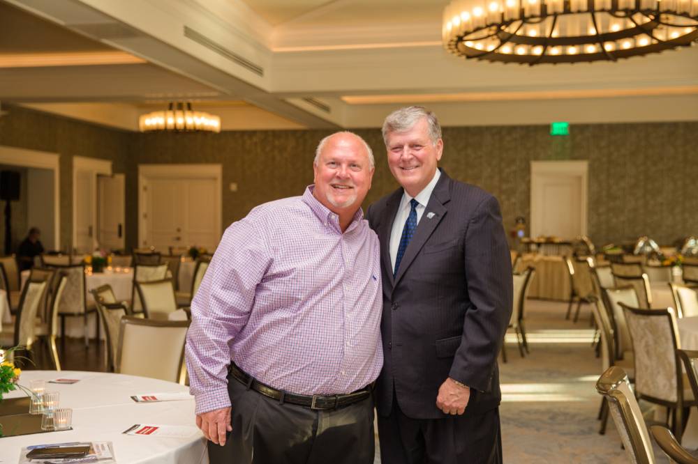 President Haas posing with a guest at Naples 2019